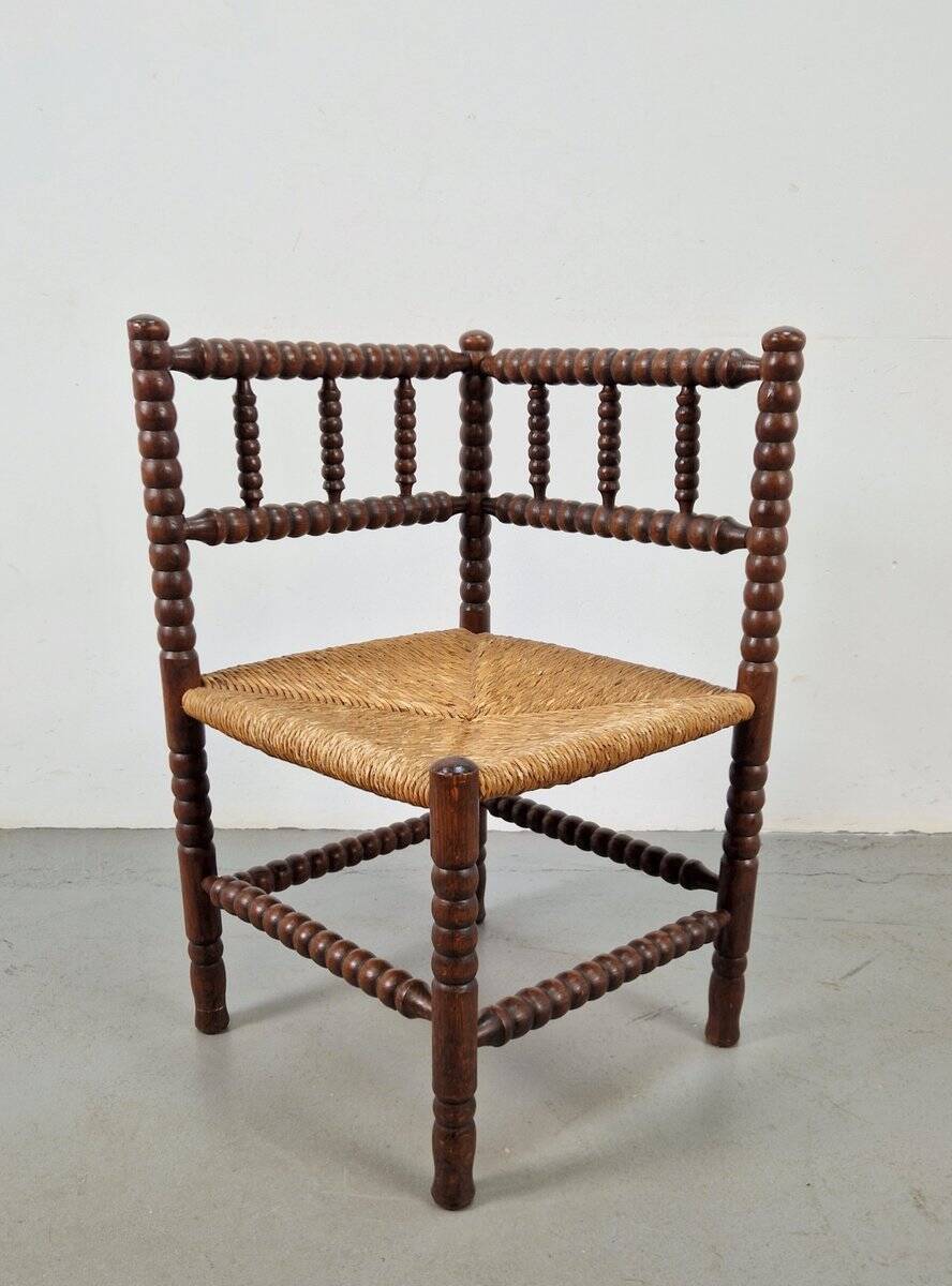 Corner chair in Arts and Crafts style made of oak with a rush seat, 1950s.