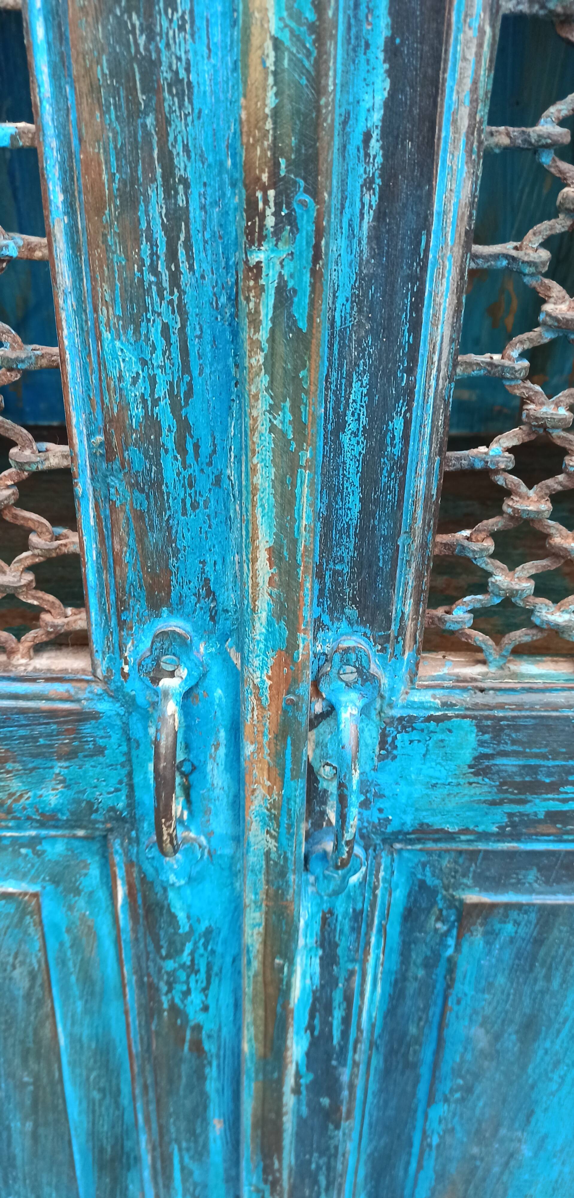 Old wooden cabinet with doors with grille