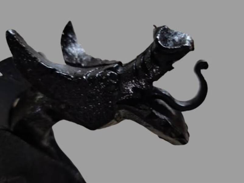 A pair of wrought iron andirons with dragon heads, 1970s.