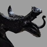 A pair of wrought iron andirons with dragon heads, 1970s.