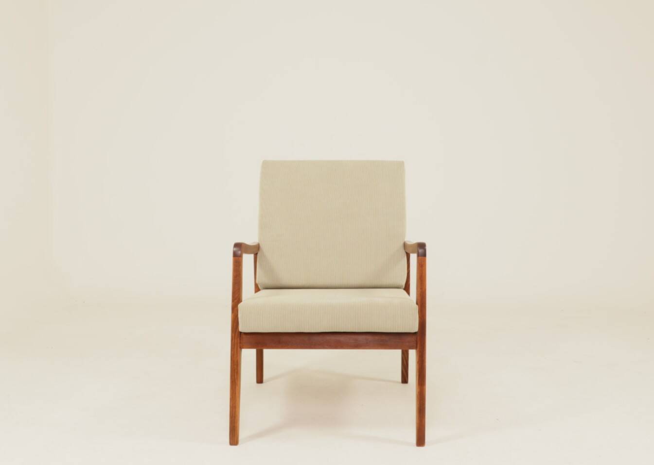 Vintage armchair in olive corduroy with a wooden frame.