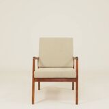 Vintage armchair in olive corduroy with a wooden frame.