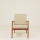 Vintage armchair in olive corduroy with a wooden frame.