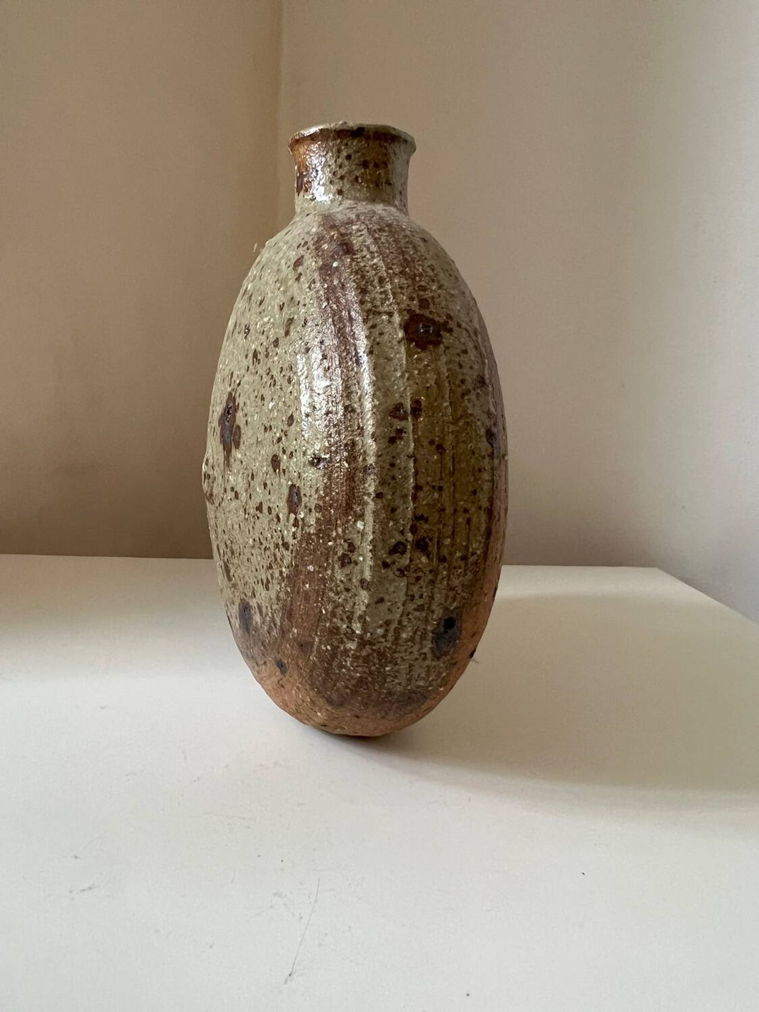 Vintage round, flat-bottomed stoneware bud vase