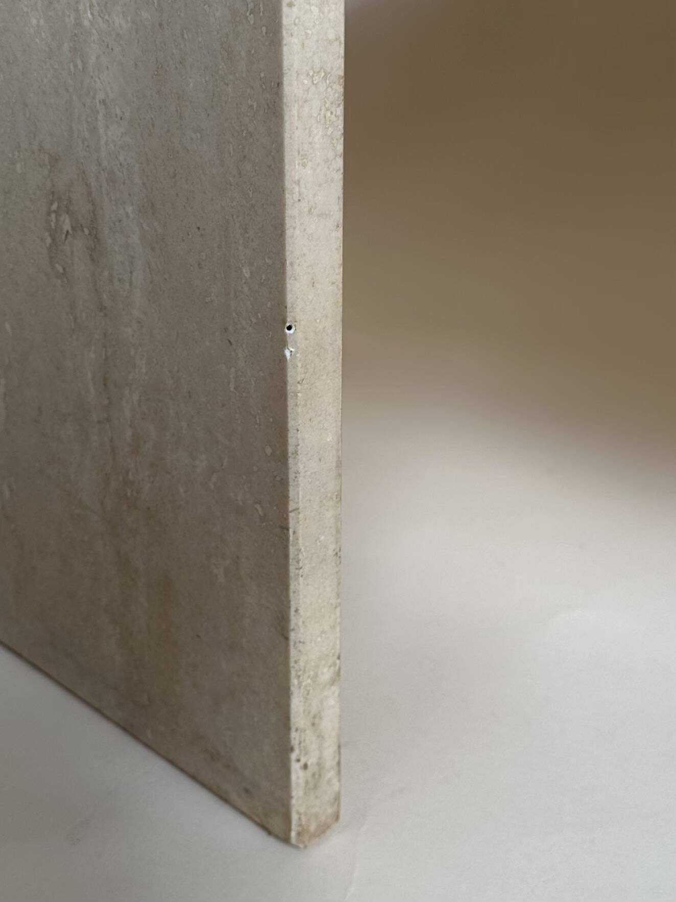 Travertine eye-shaped coffee table