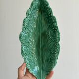 Green earthenware dish in the shape of a leaf