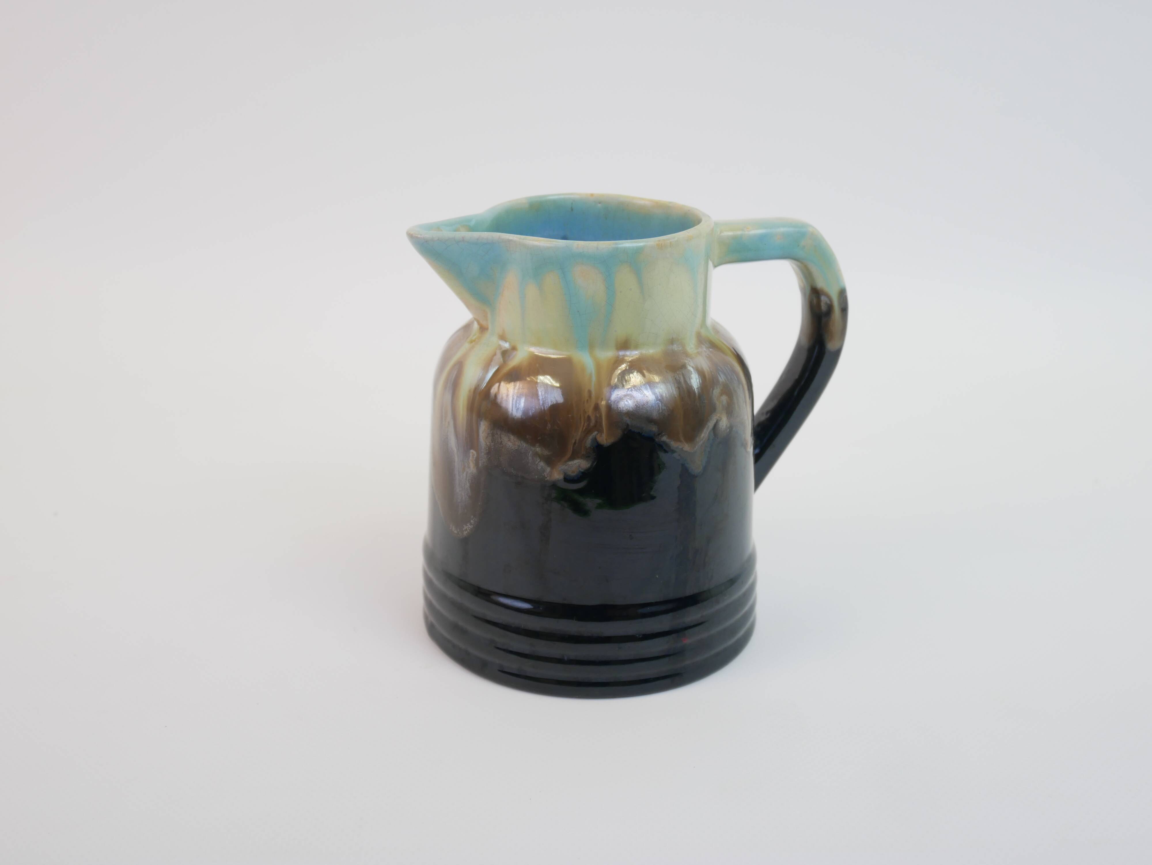 Art Deco pitcher in black, brown and blue glazed ceramic