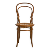Bistro chair with curved wooden armrests and canning seat