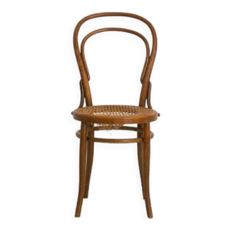 Bistro chair with curved wooden armrests and canning seat