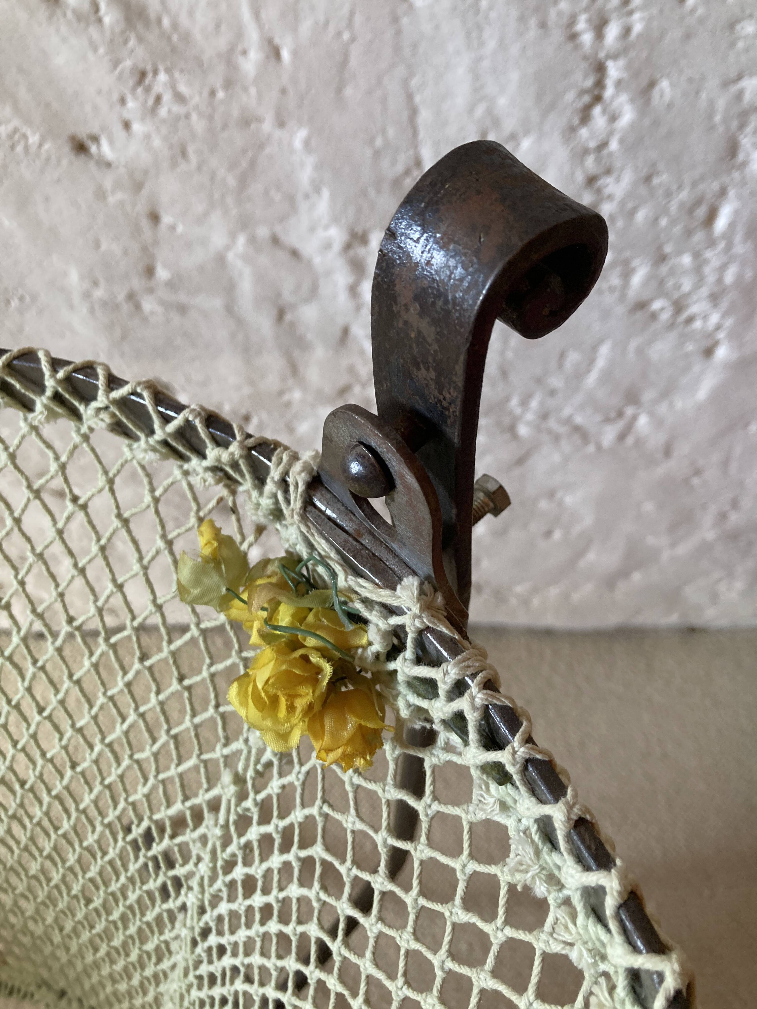 Antique rocking cradle in wrought iron