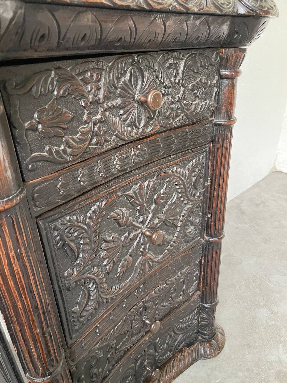 19th century chest of drawers in carved blackened pine