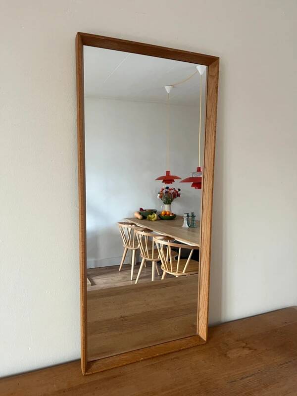 Vintage Danish oak mirror with bevelled edges.