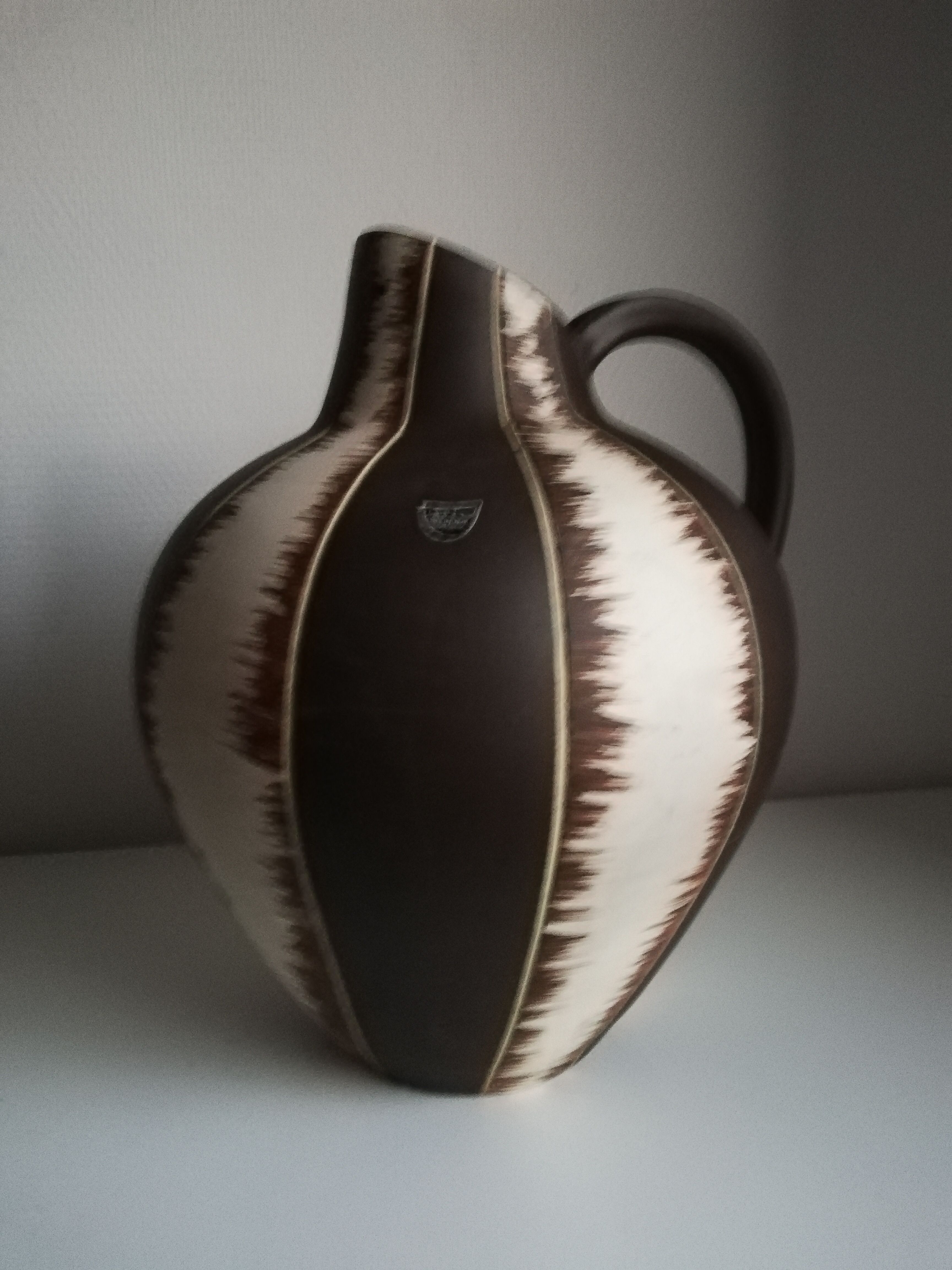 Ceramic pitcher signed