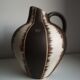 Ceramic pitcher signed