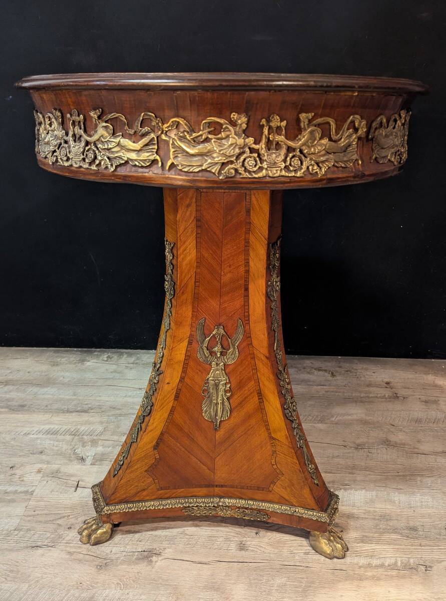 Circular gueridon in marquetry and bronze, Empire style