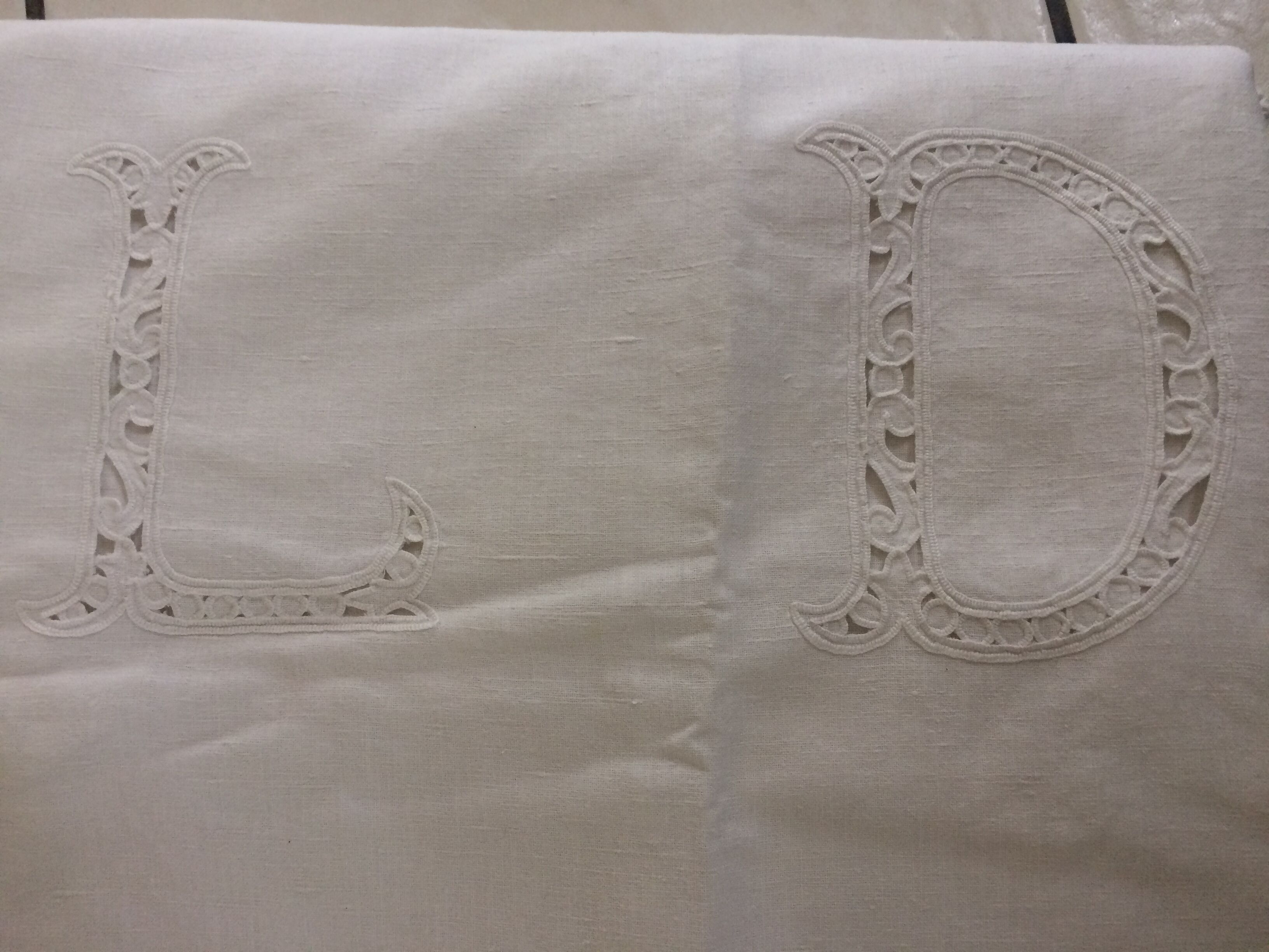 Old sheet with monograms and wide hand made embroider.