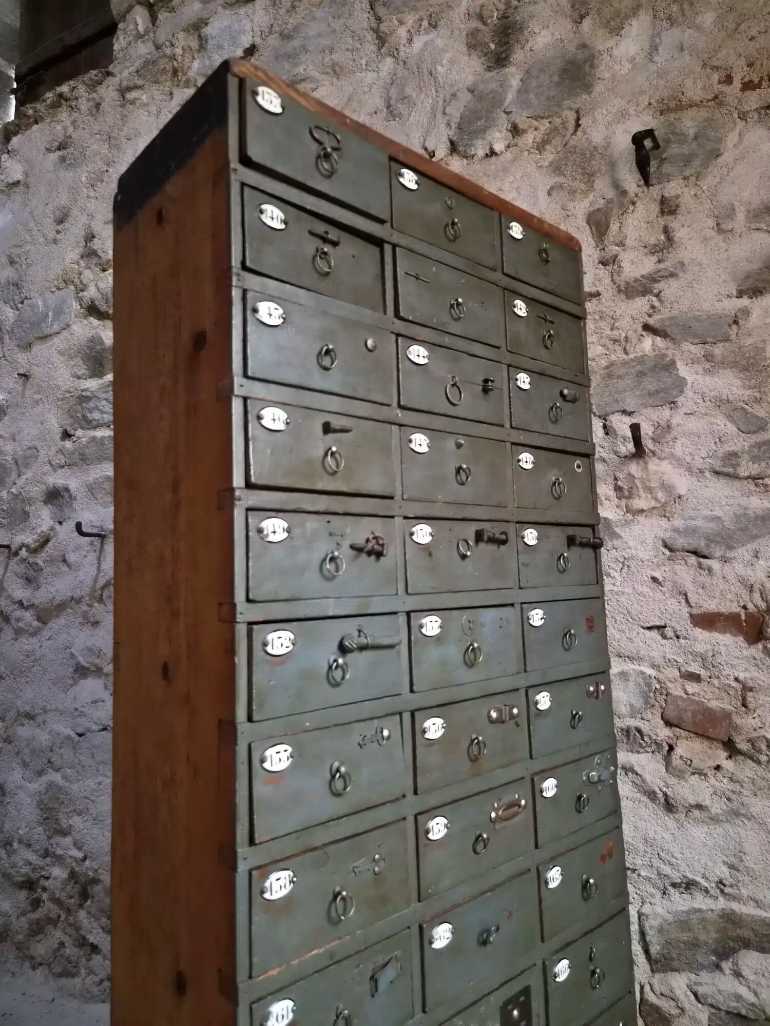Antique hardware cabinet with 48 drawers, circa 1900.