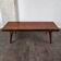 Teak coffee table with opening and drawer by Johannes Andersen for Uldum Møbelfabrik, Denmark, 1960.
