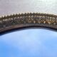 Oval mirror in gold metal
