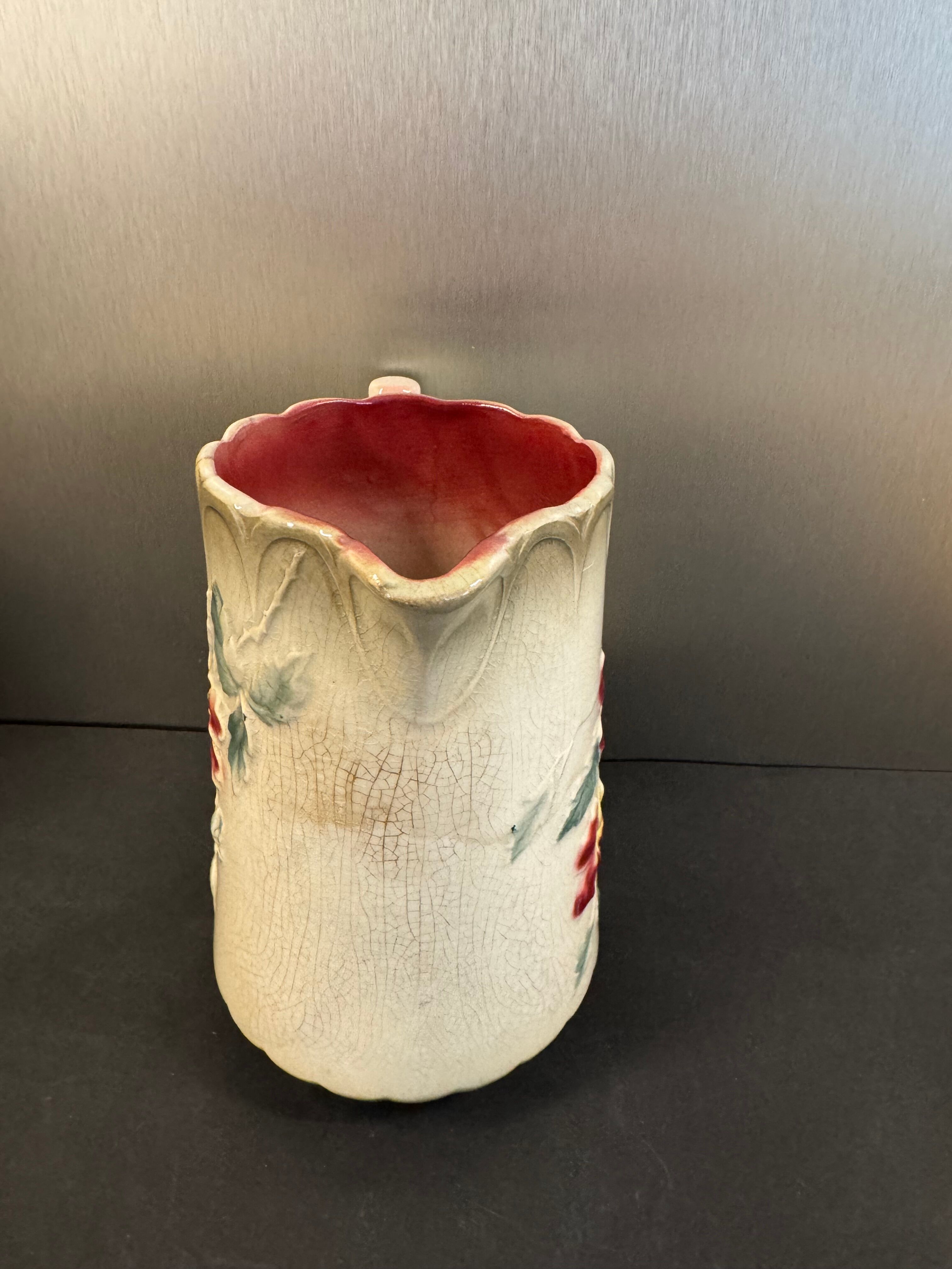 Antique pitcher in slipware with floral decoration – red and cream floral design