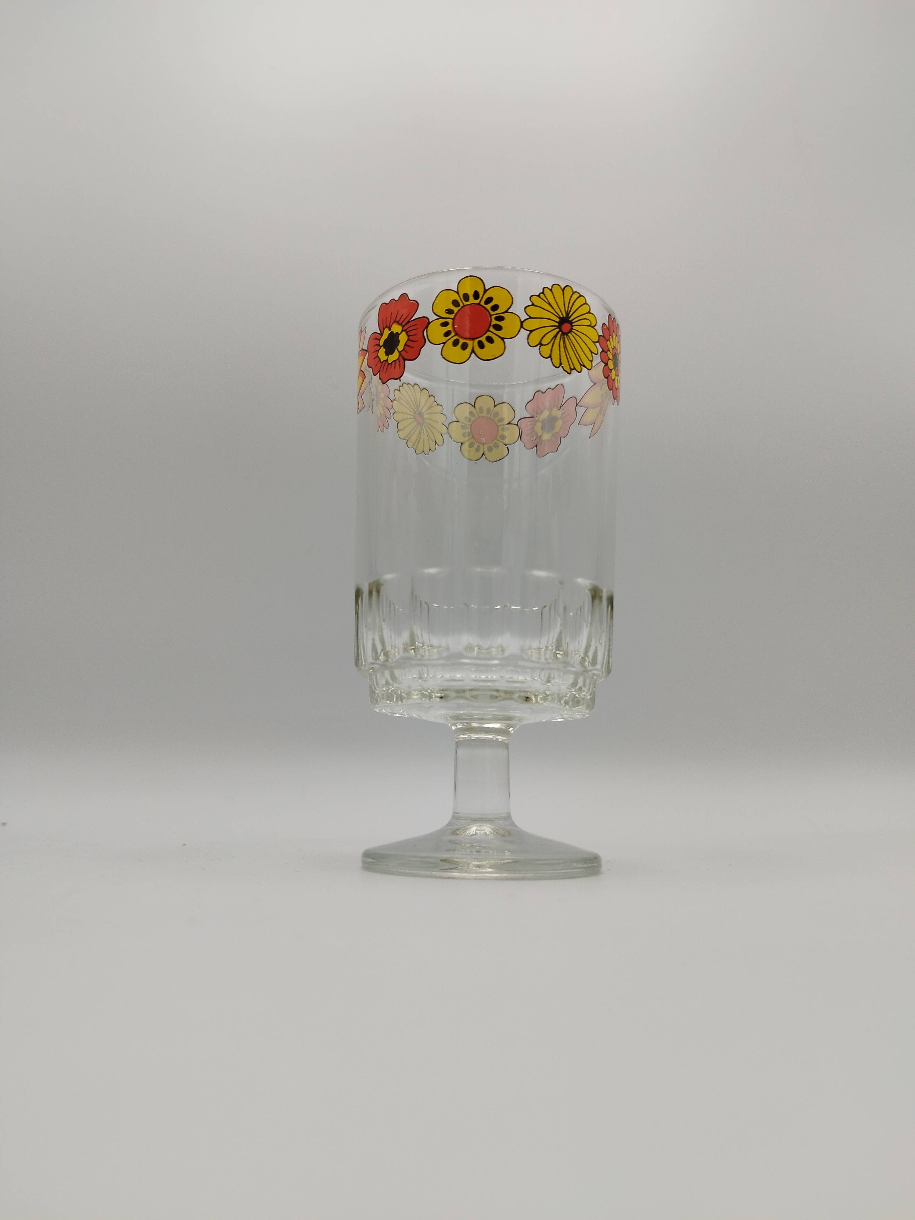 Vintage stemmed glass with floral decoration