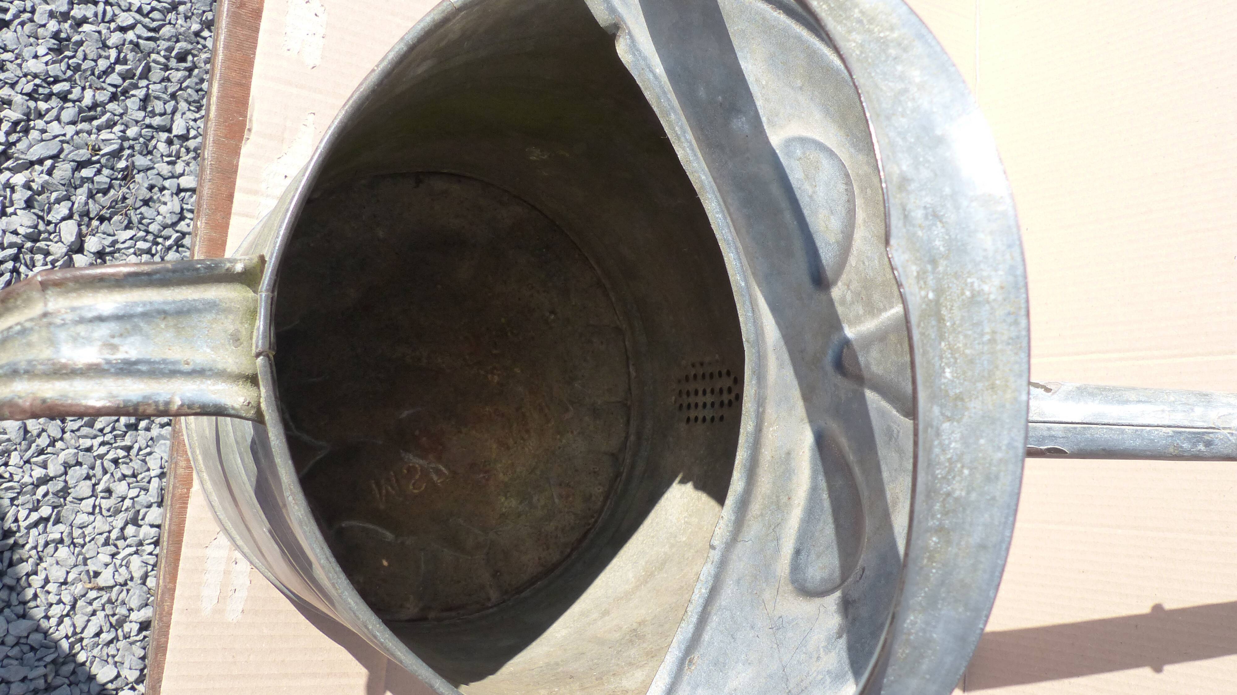 watering can with pommel