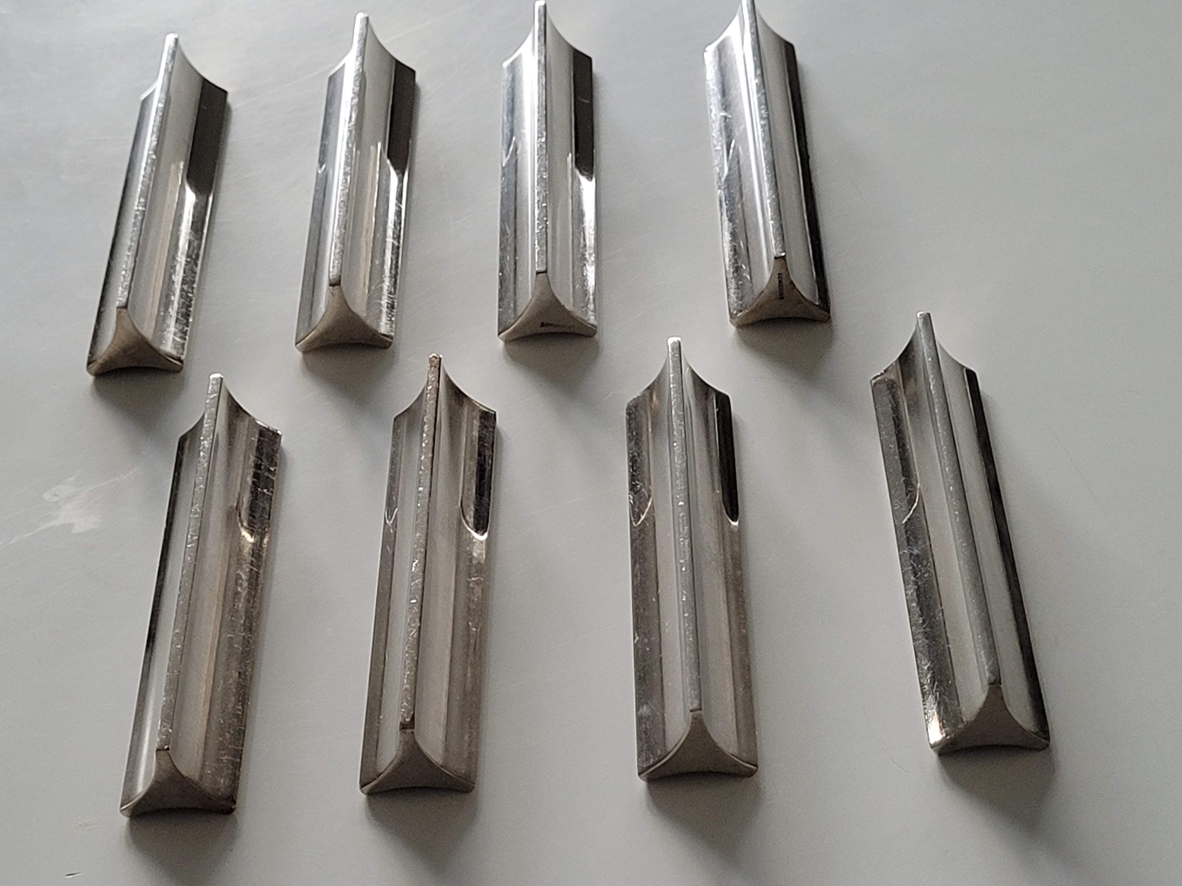 Eight Boulenger knife holders in art deco silver metal