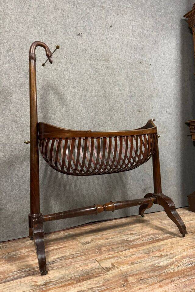Empire style mahogany cradle with a swan neck, shaped like a cradle, circa 1810