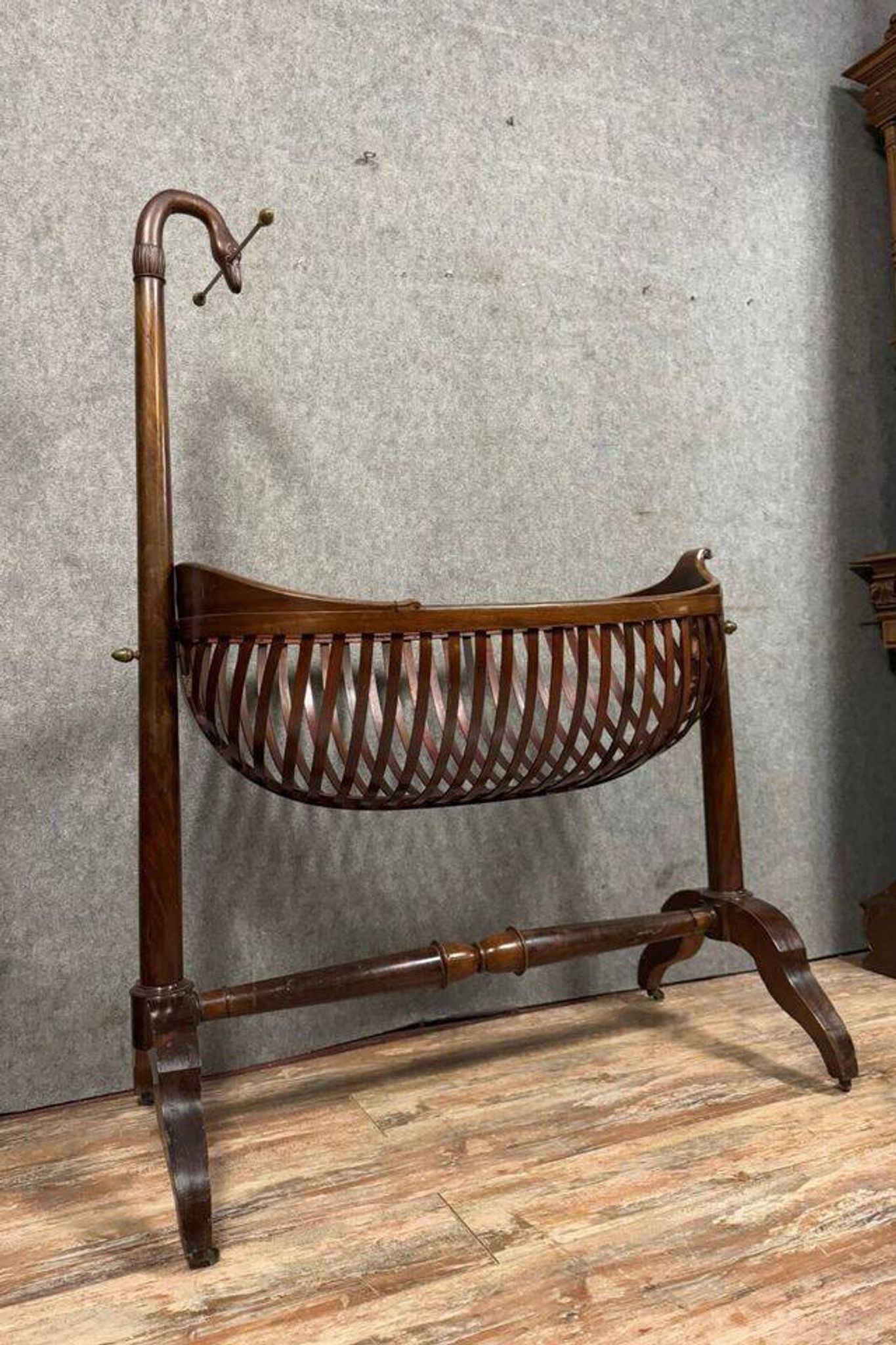 Empire style mahogany cradle with a swan neck, shaped like a cradle, circa 1810