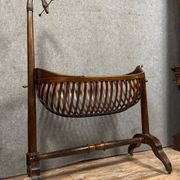 Empire style mahogany cradle with a swan neck, shaped like a cradle, circa 1810