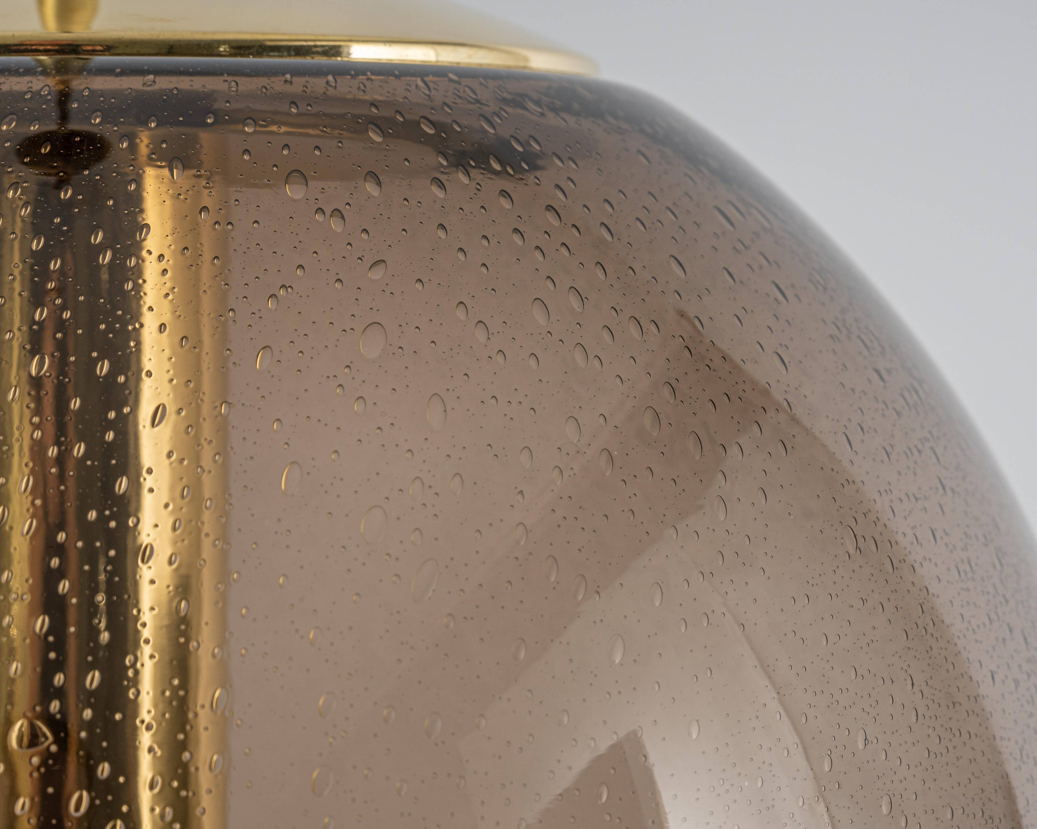 Large smoked glass ball pendant by Limburg in brass, Germany, 1970s.