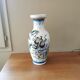 Vintage ceramic vase with Asian decor.