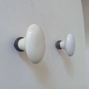 Pair of antique oval door handles in porcelain and brass.