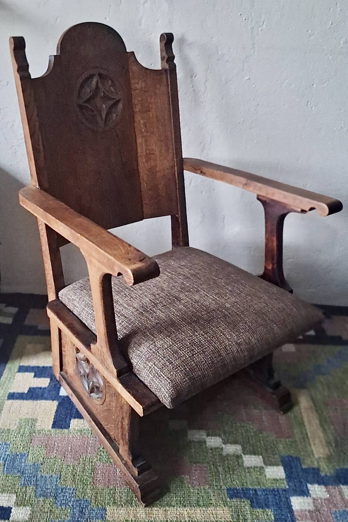 Antique Gothic Revival carved oak armchair, 1910