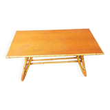 Rattan coffee table with compass legs