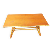 Rattan coffee table with compass legs