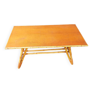 Rattan coffee table with compass legs
