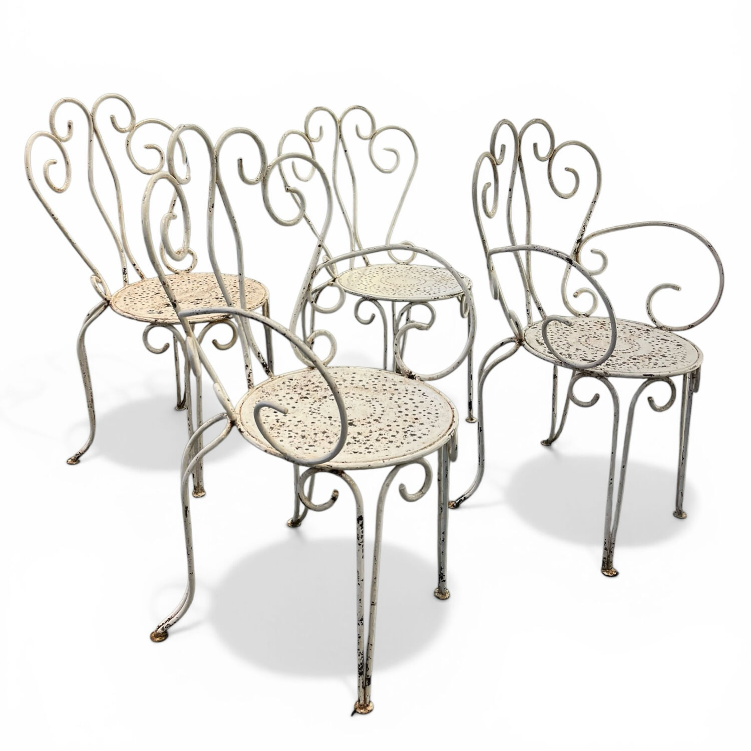 Set of 4 white wrought iron garden chairs, 1950s.