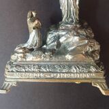Metal statue and music box