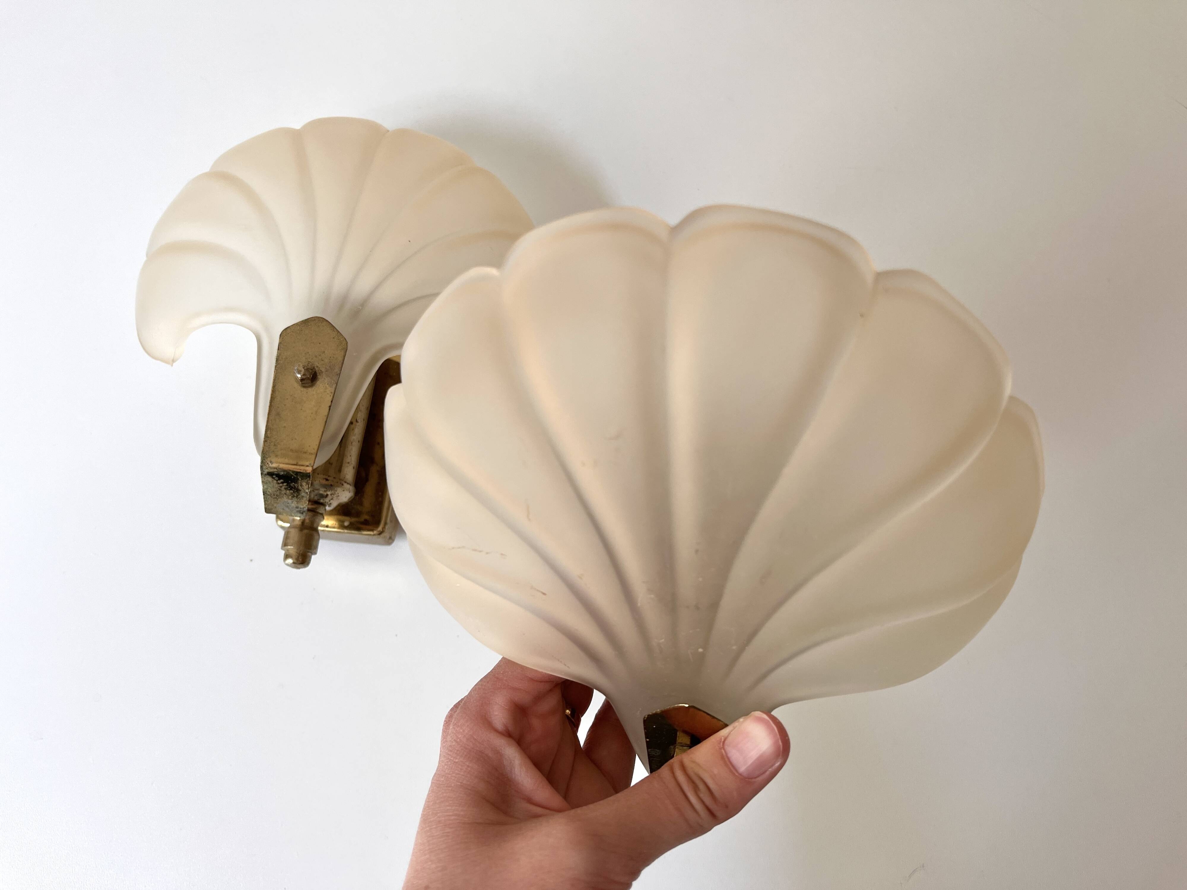 Pair of vintage shell glass wall lights, Art Deco style fixtures.