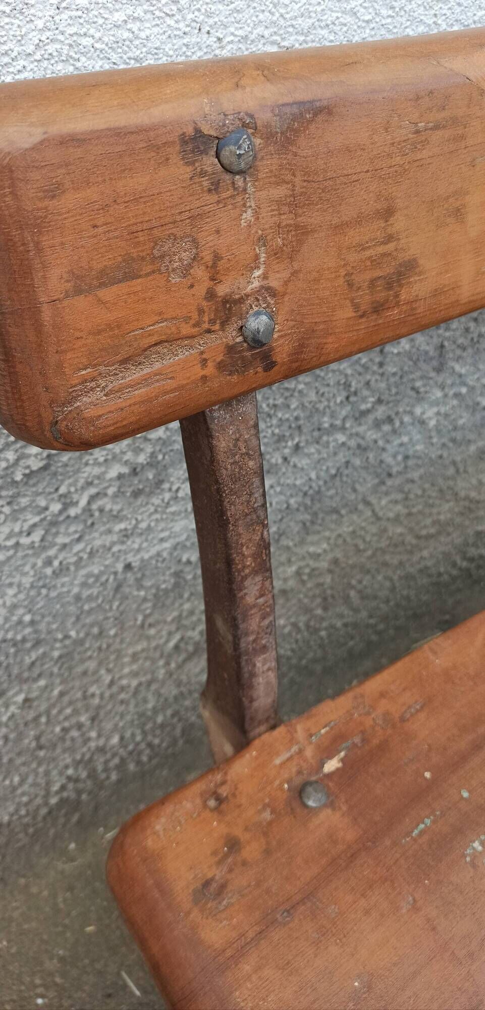 Old wooden bench with cast iron base