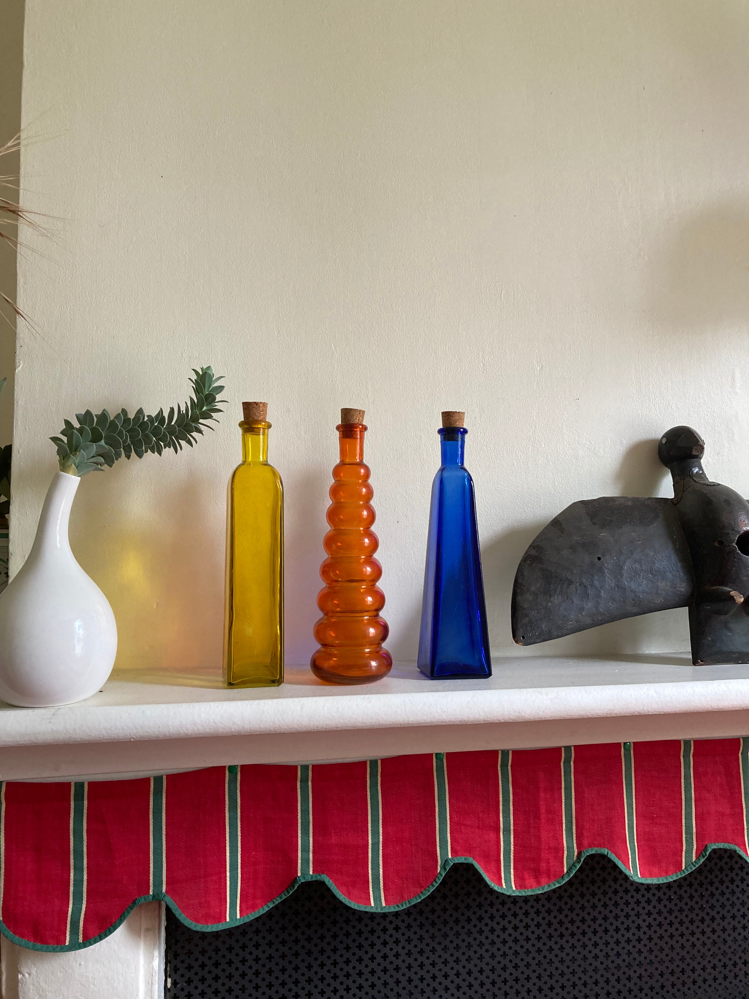 Trio of bottles 1970 color orange yellow and blue geometric shape