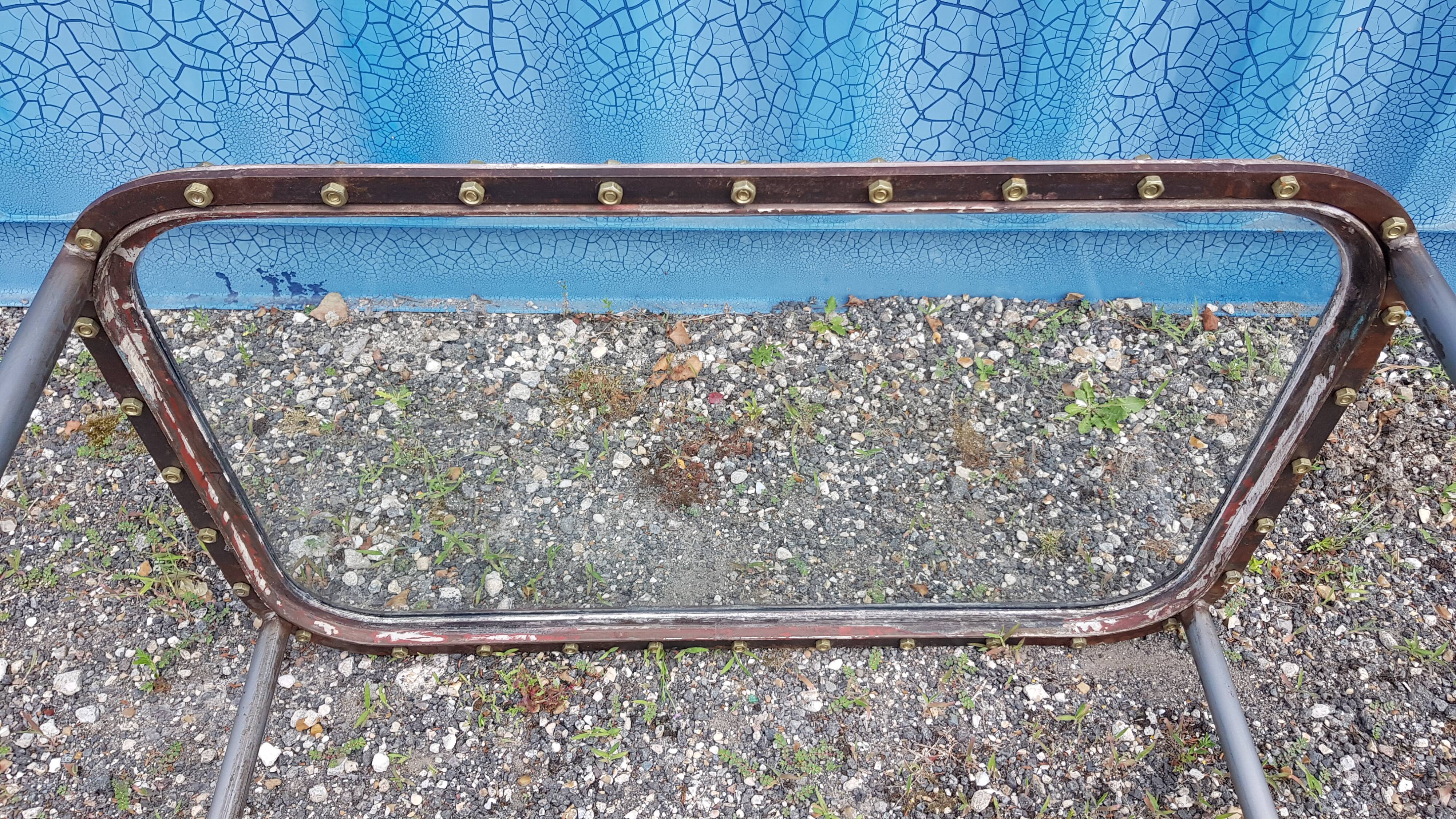Table with an old ship porthole in brass and a metal base / 110 x 70 x 76 cm