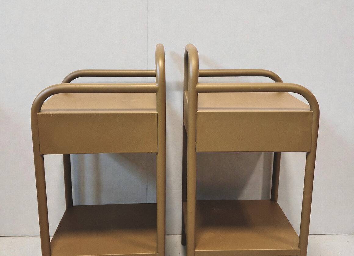 Old ochre metal bedside tables from a boarding school.