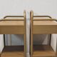 Old ochre metal bedside tables from a boarding school.