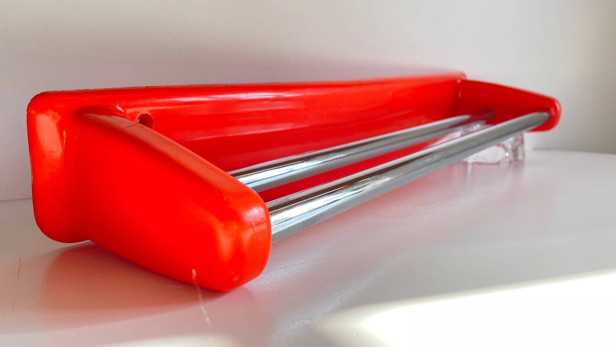 Orange towel rack by Syla from the 70s