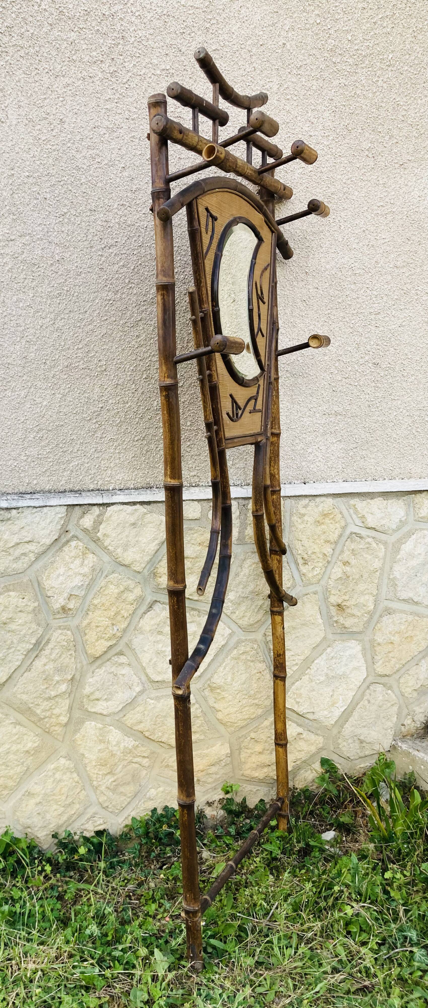 Bamboo coat rack from the 19th century, mirror in the shape of a crescent moon.