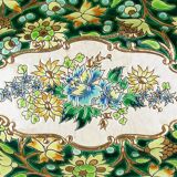 Longwy cup in cloisonné enamels on a green background, polychrome floral decoration and gold