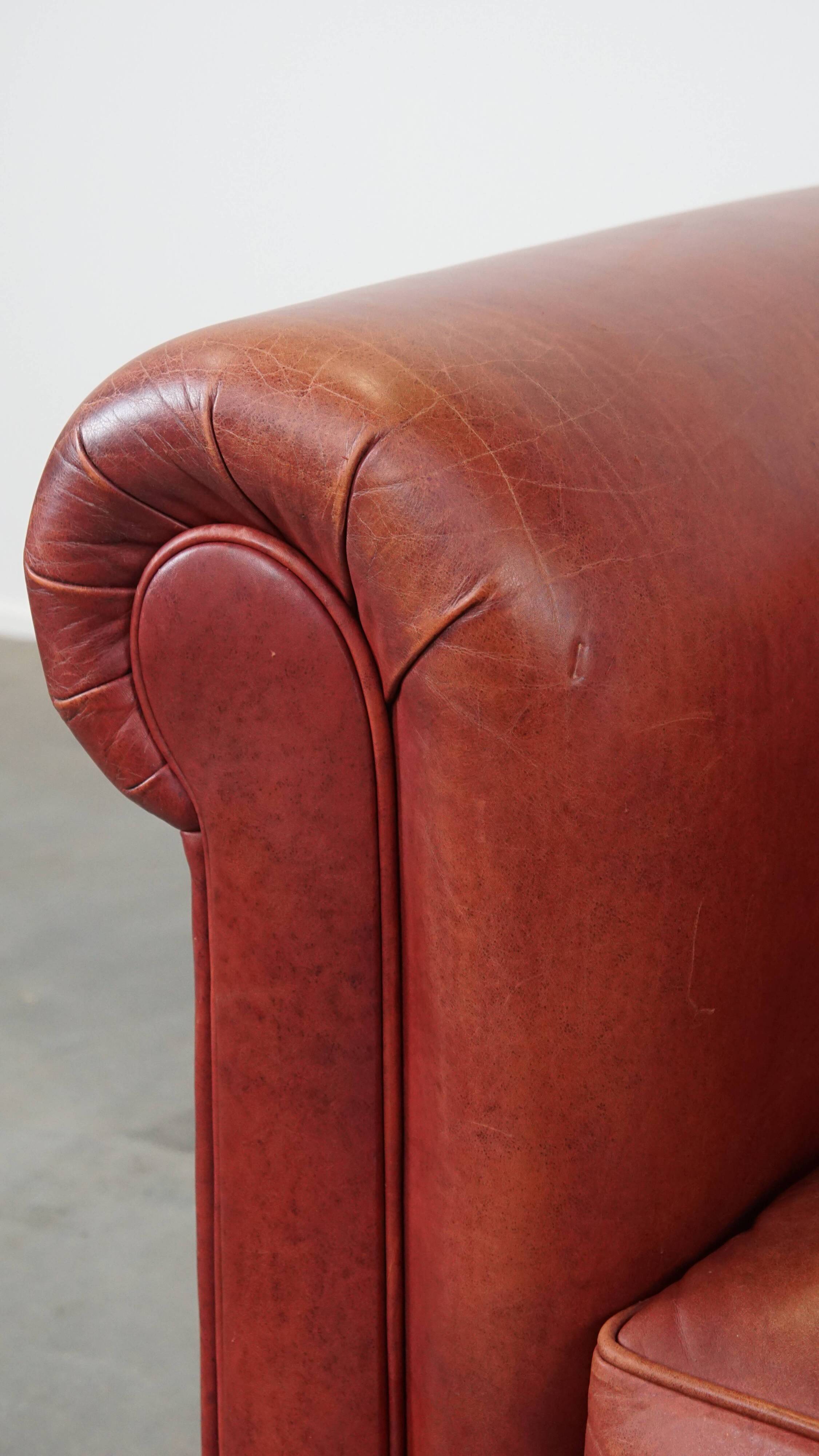 English Chesterfield club chair in light red cowhide leather