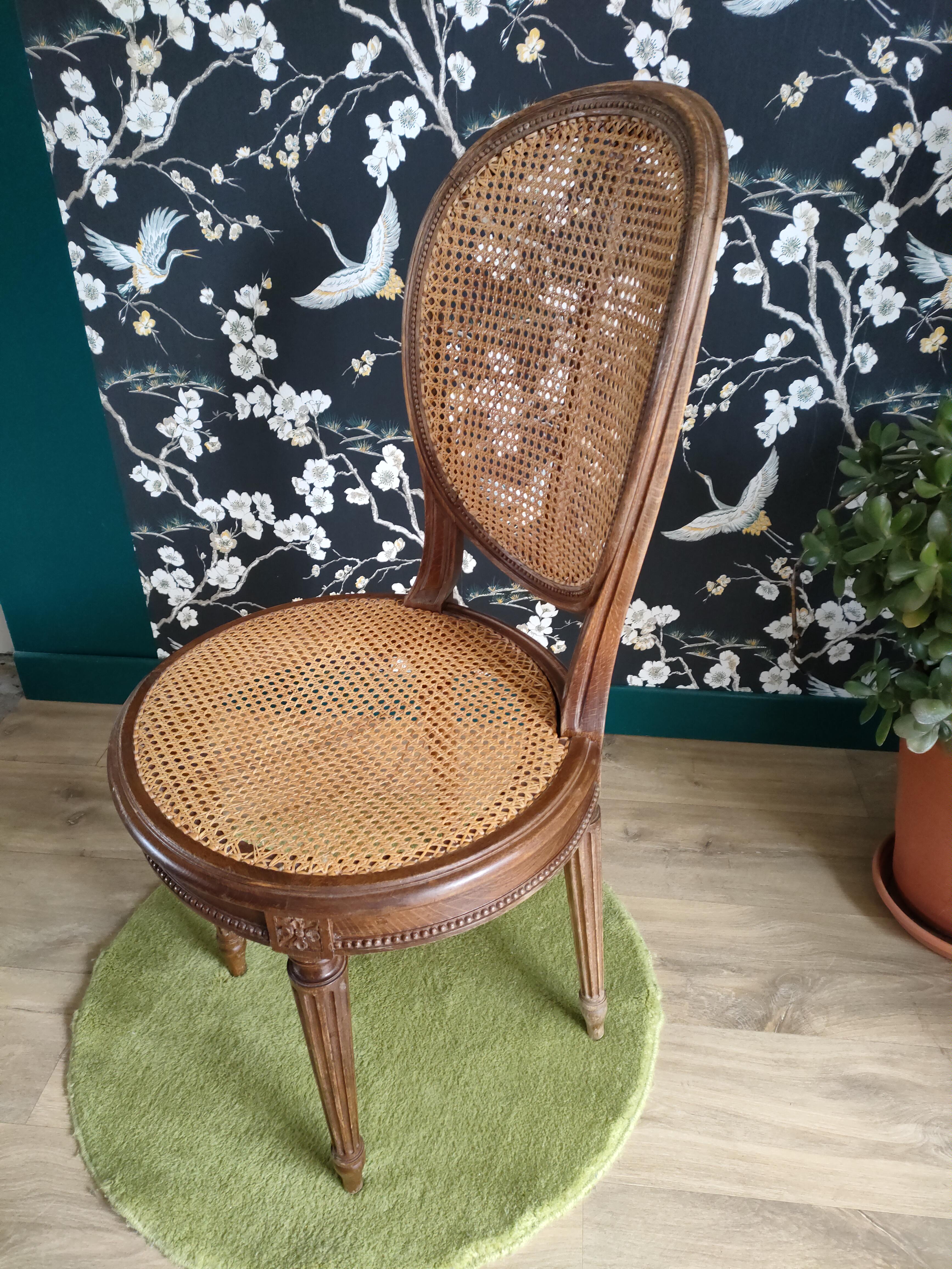 Wooden chair sitting in cannage